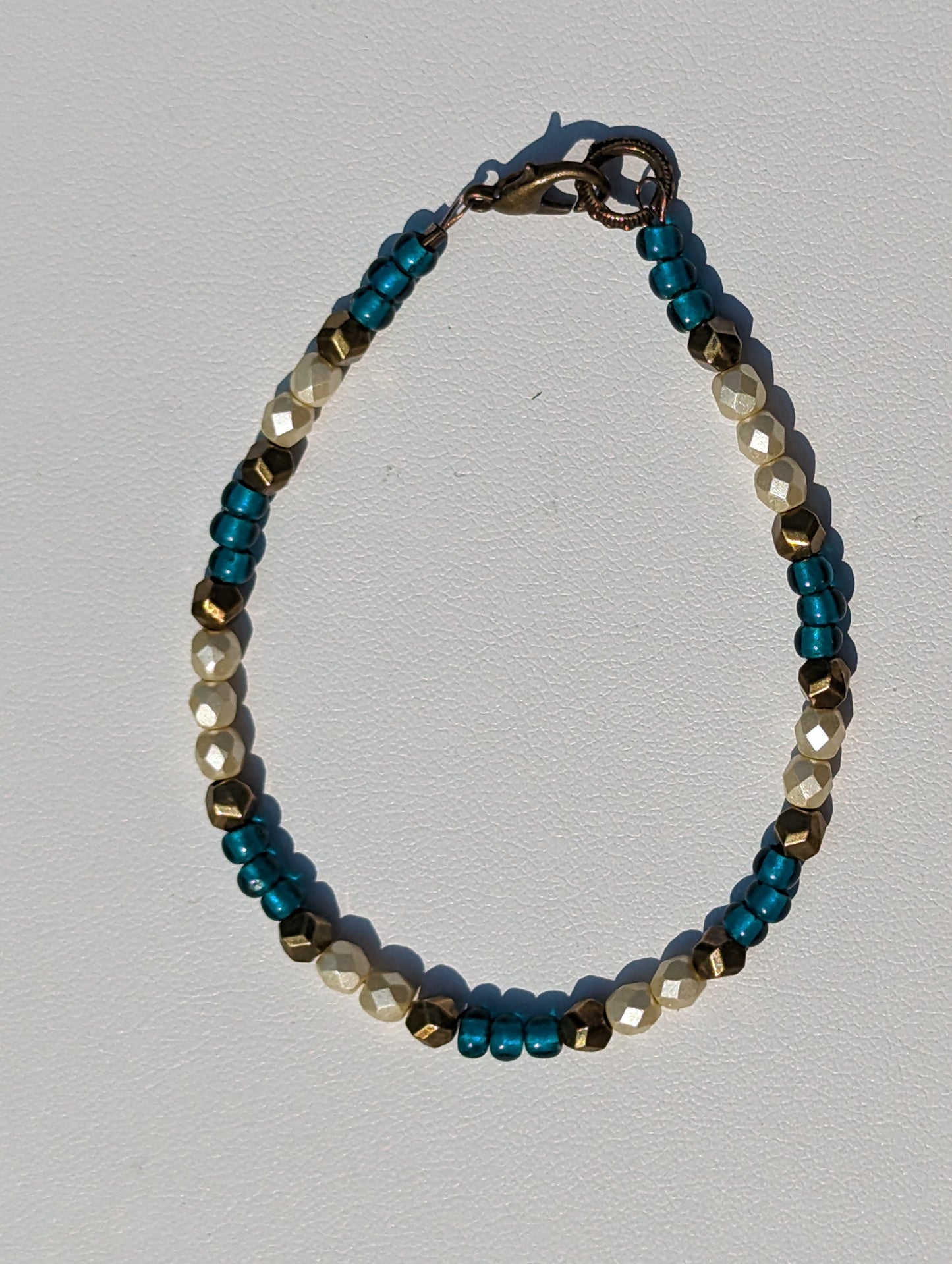 Bracelet with Teal, Pearlesque, and Brass Beads