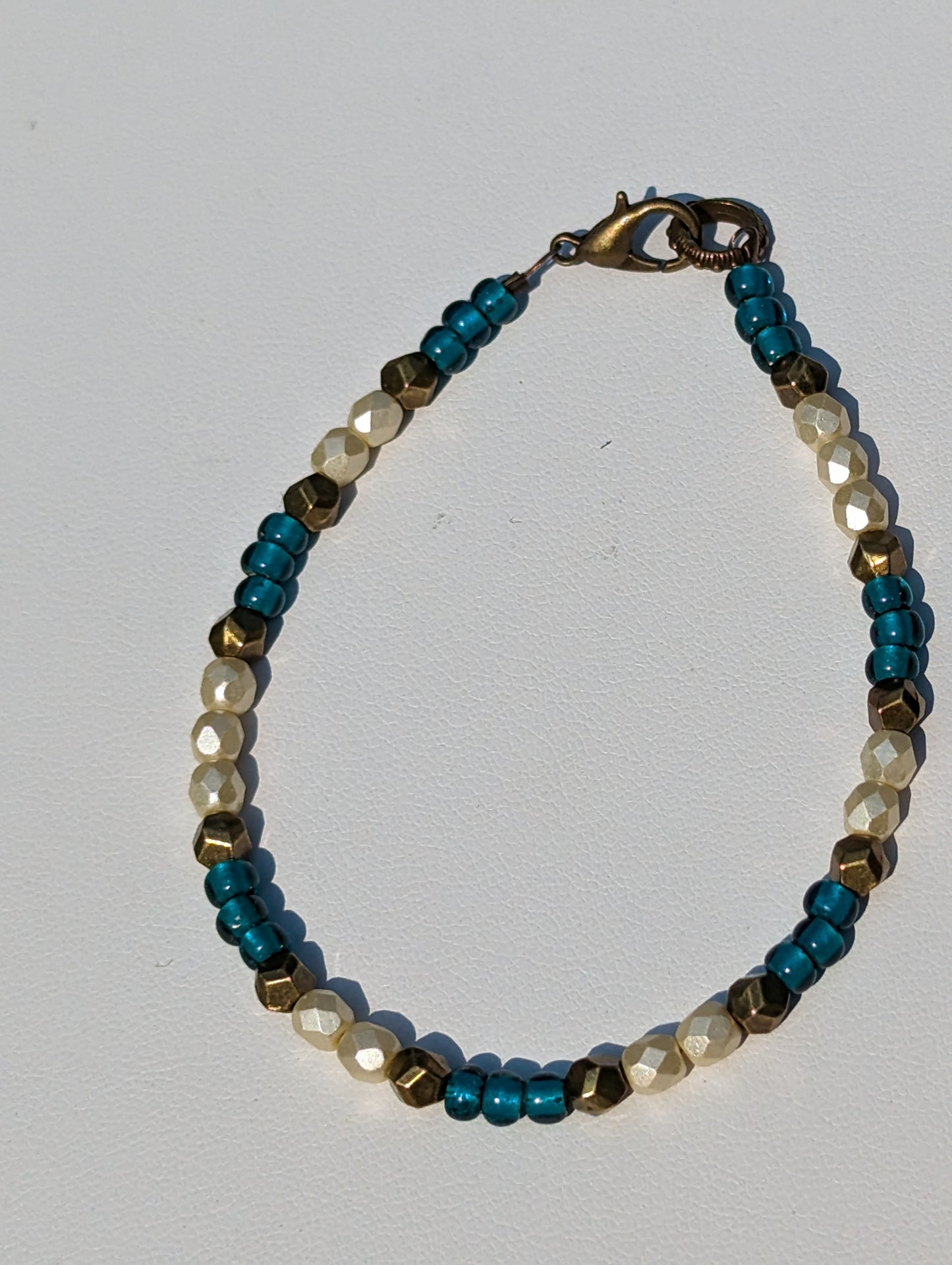 Bracelet with Teal, Pearlesque, and Brass Beads