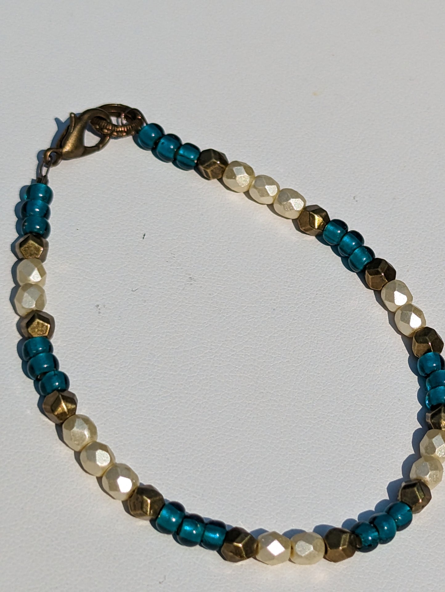 Bracelet with Teal, Pearlesque, and Brass Beads