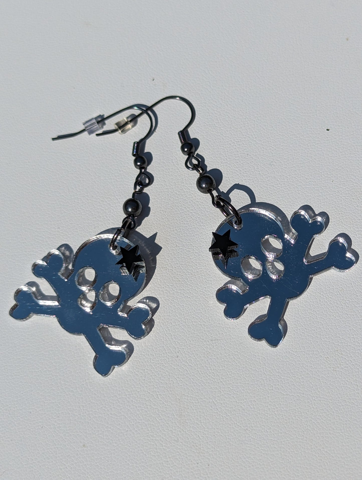 Skull and Crossbones Mirror Earrings with Hematite Bead