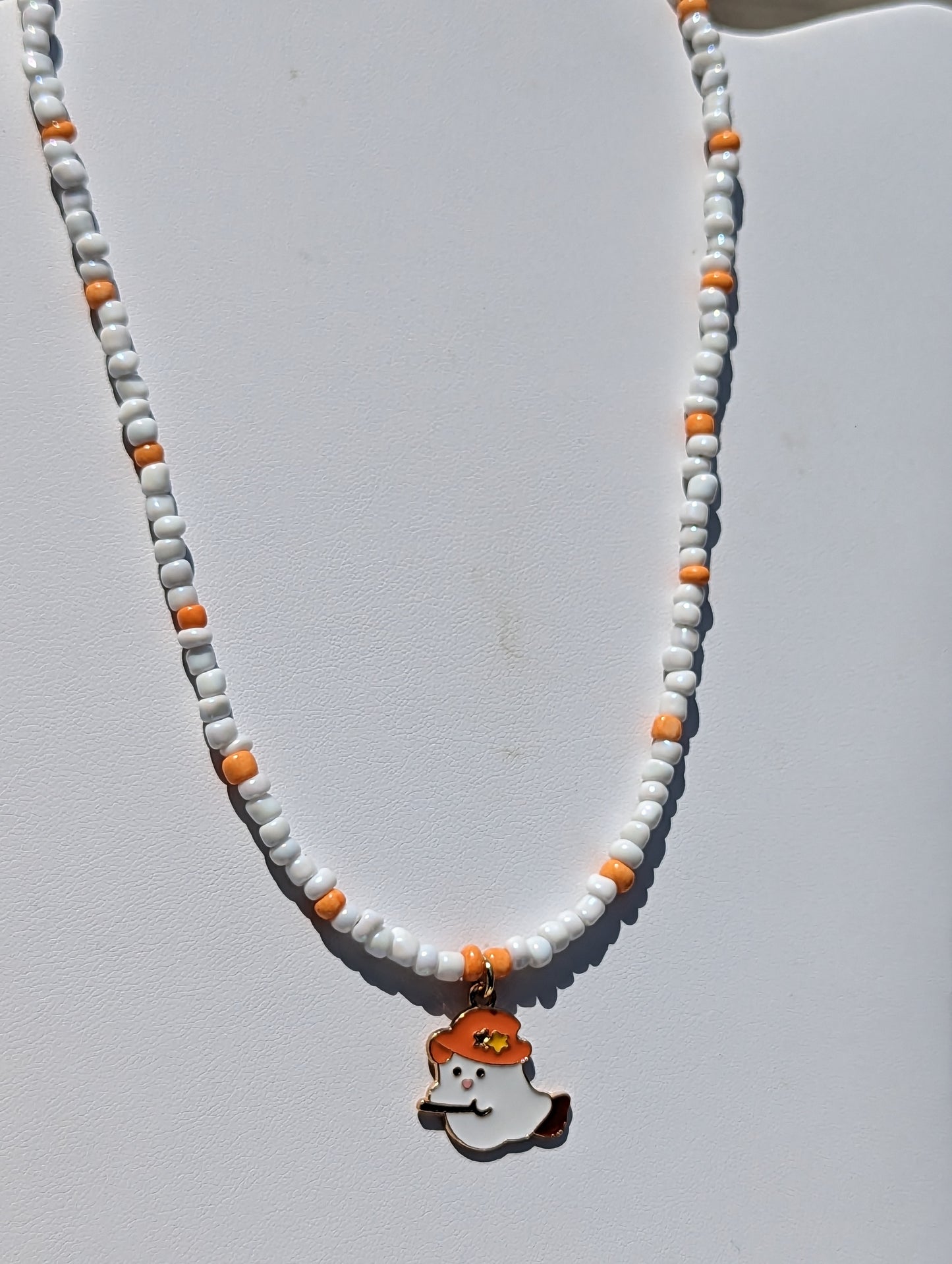 Friendly Ghost Pendant on White and Orange Beaded Necklace