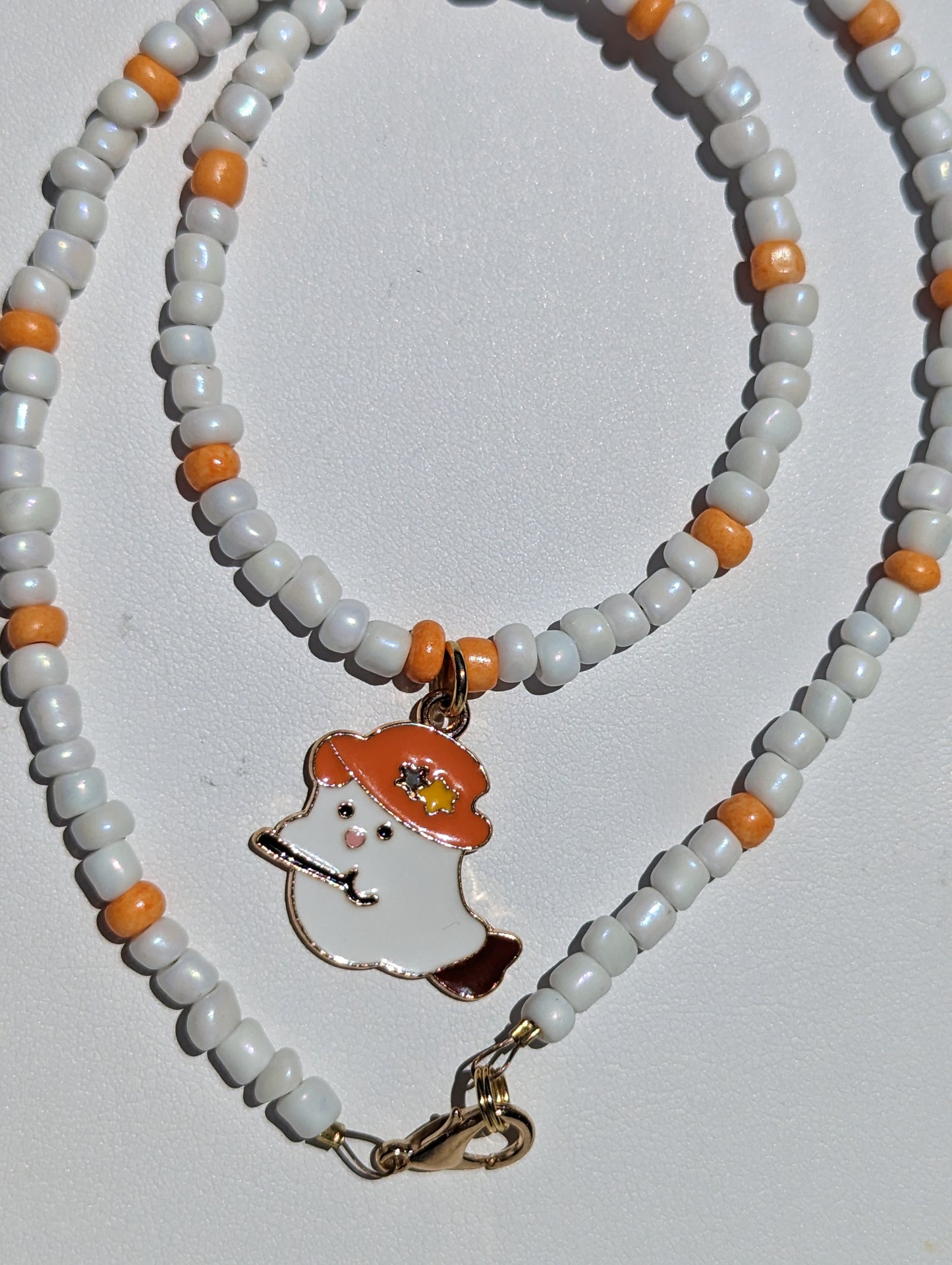 Friendly Ghost Pendant on White and Orange Beaded Necklace