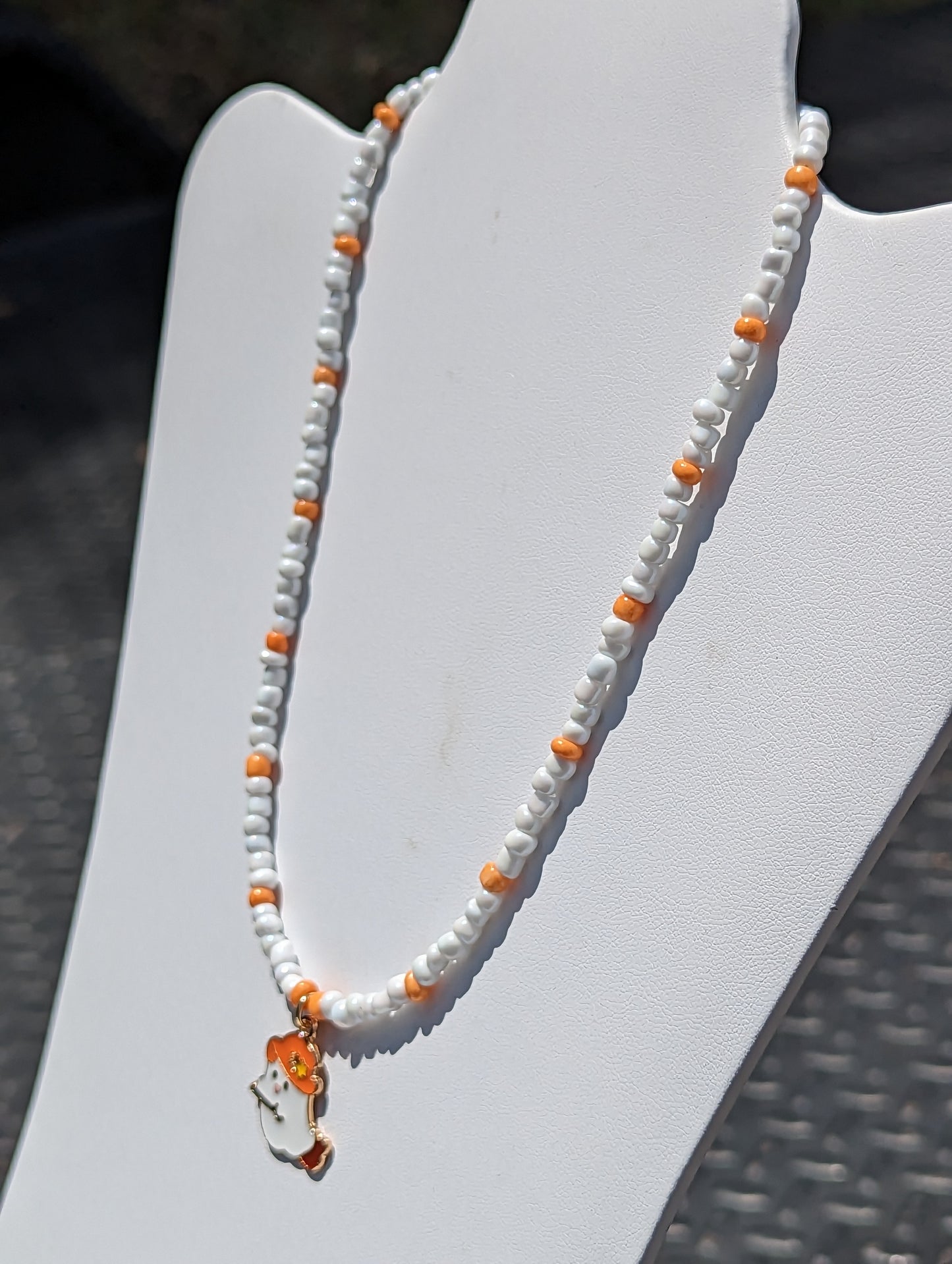 Friendly Ghost Pendant on White and Orange Beaded Necklace
