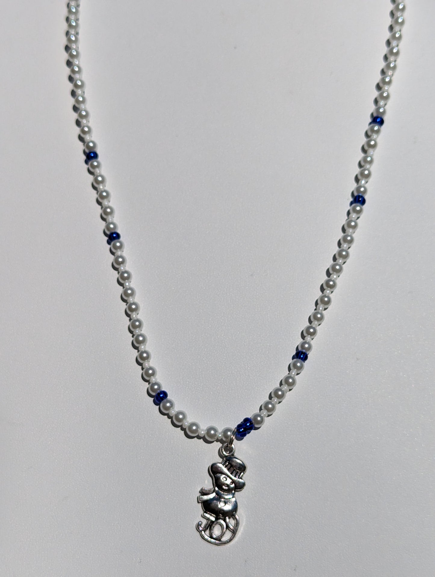 White Beaded Necklace with Silver-tone Snowman Pendant