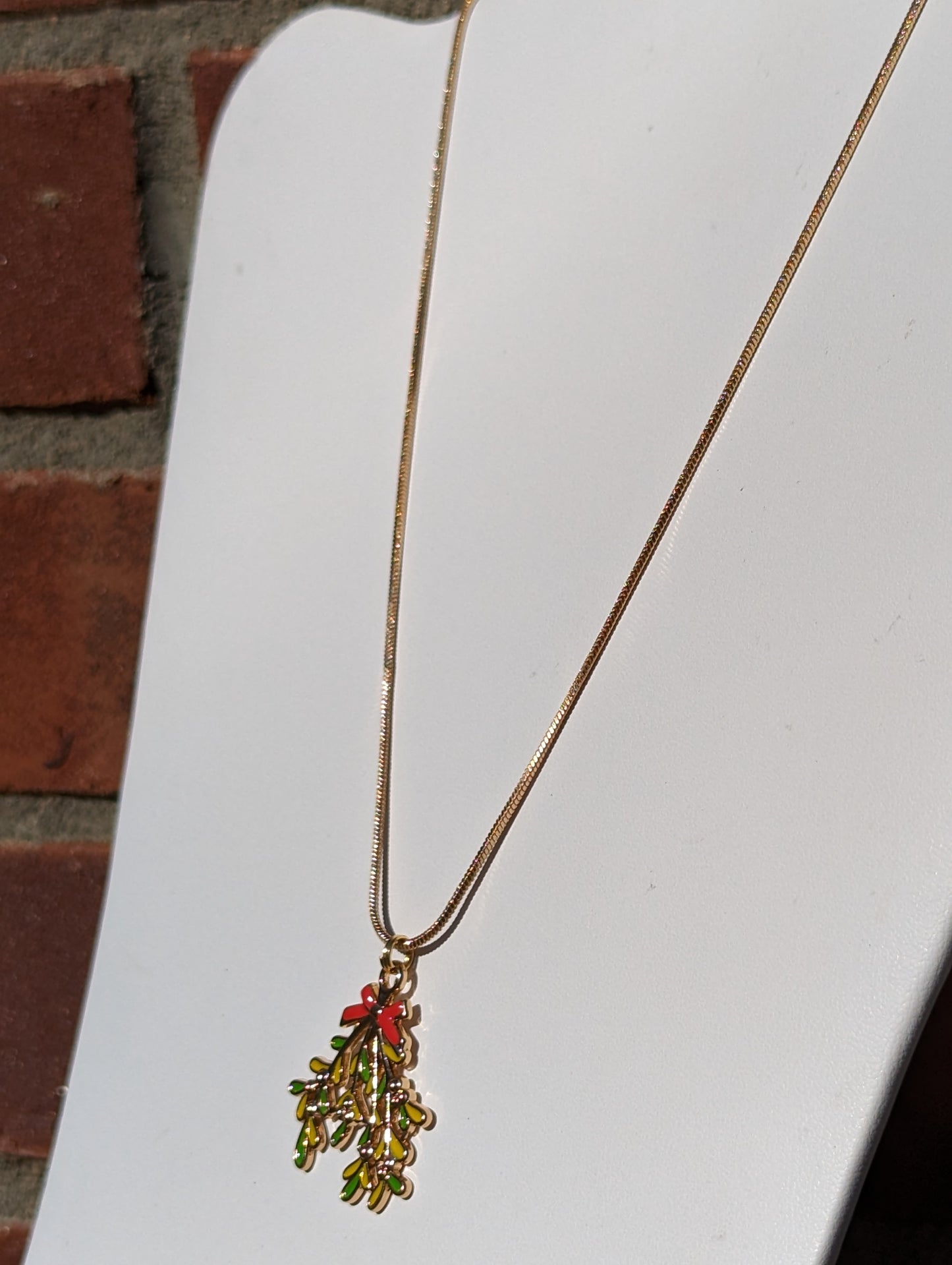 Golden Necklace with Mistletoe Pendant