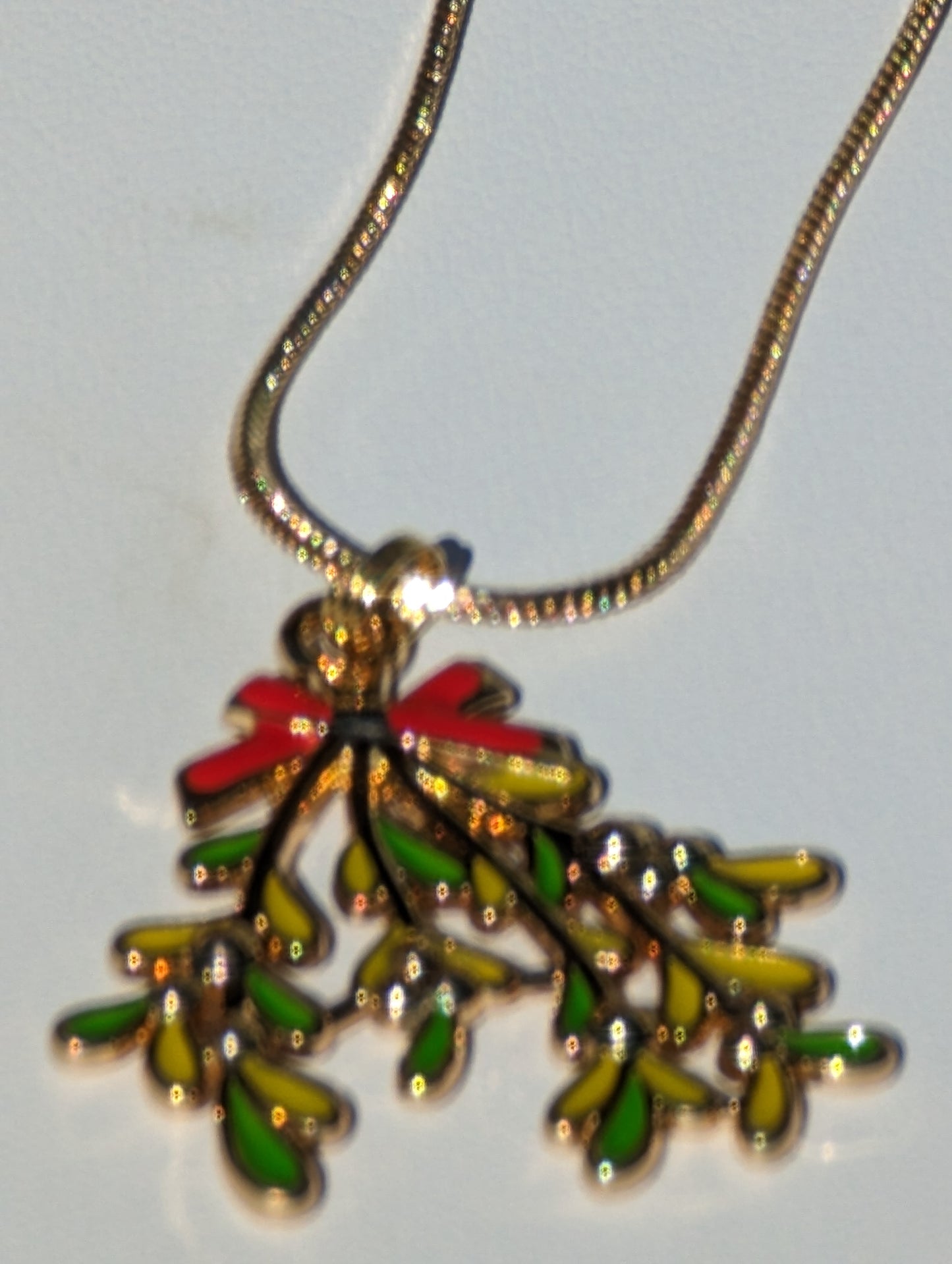 Golden Necklace with Mistletoe Pendant
