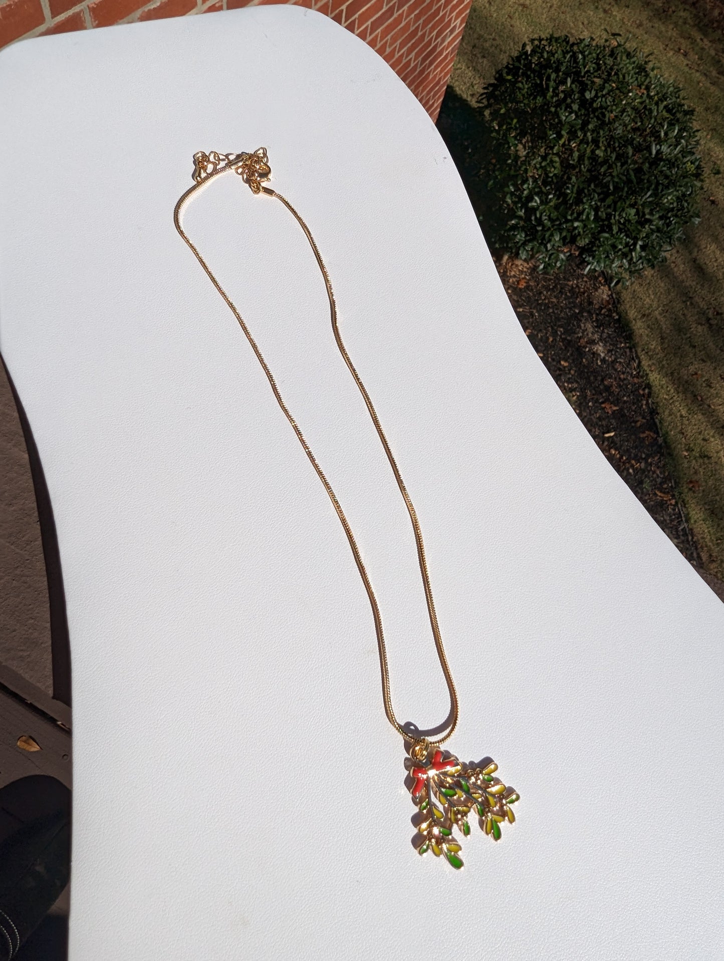 Golden Necklace with Mistletoe Pendant
