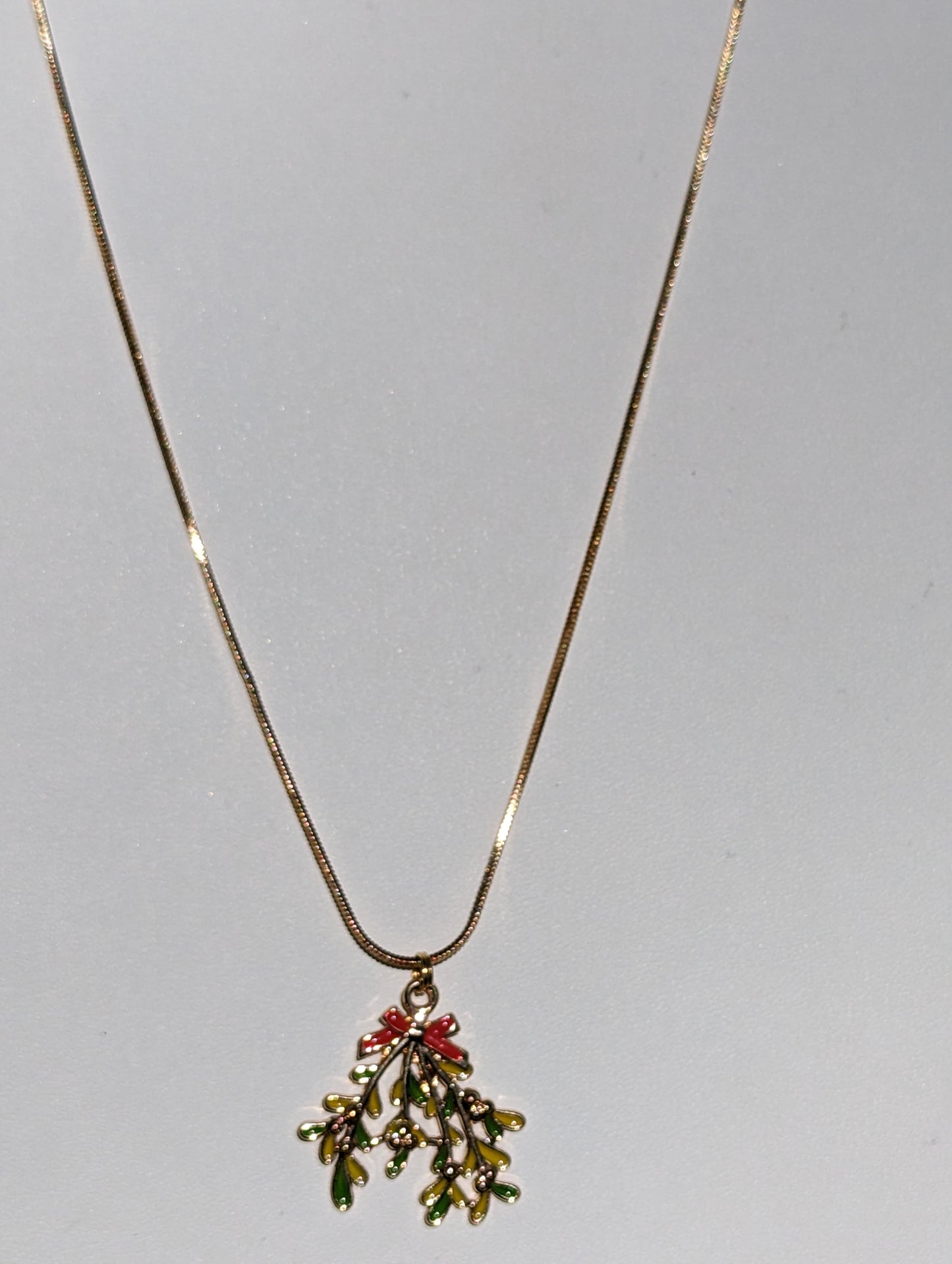 Golden Necklace with Mistletoe Pendant