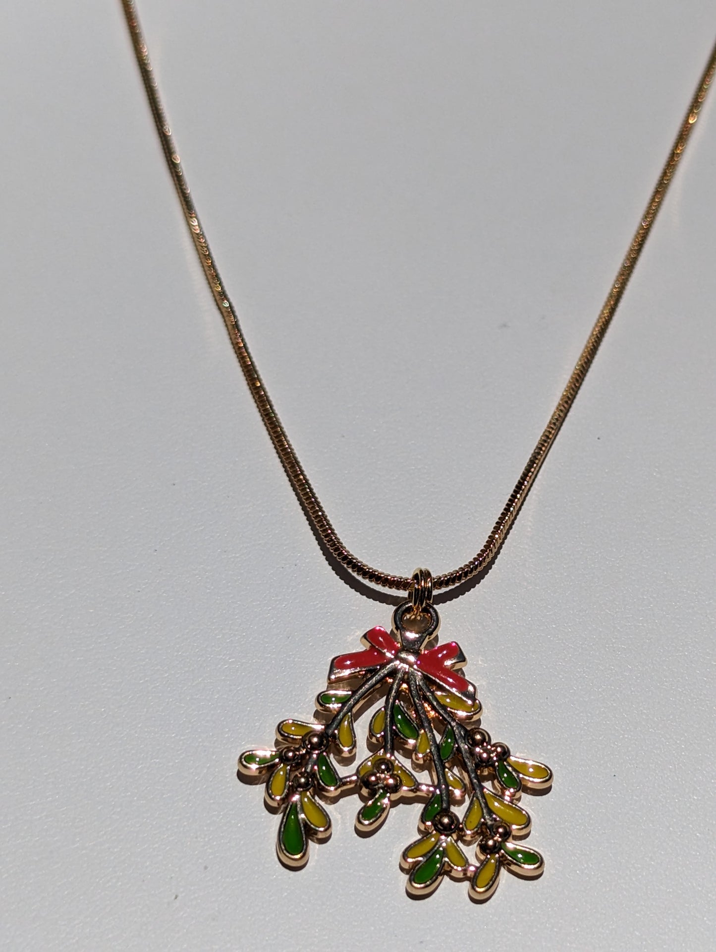 Golden Necklace with Mistletoe Pendant