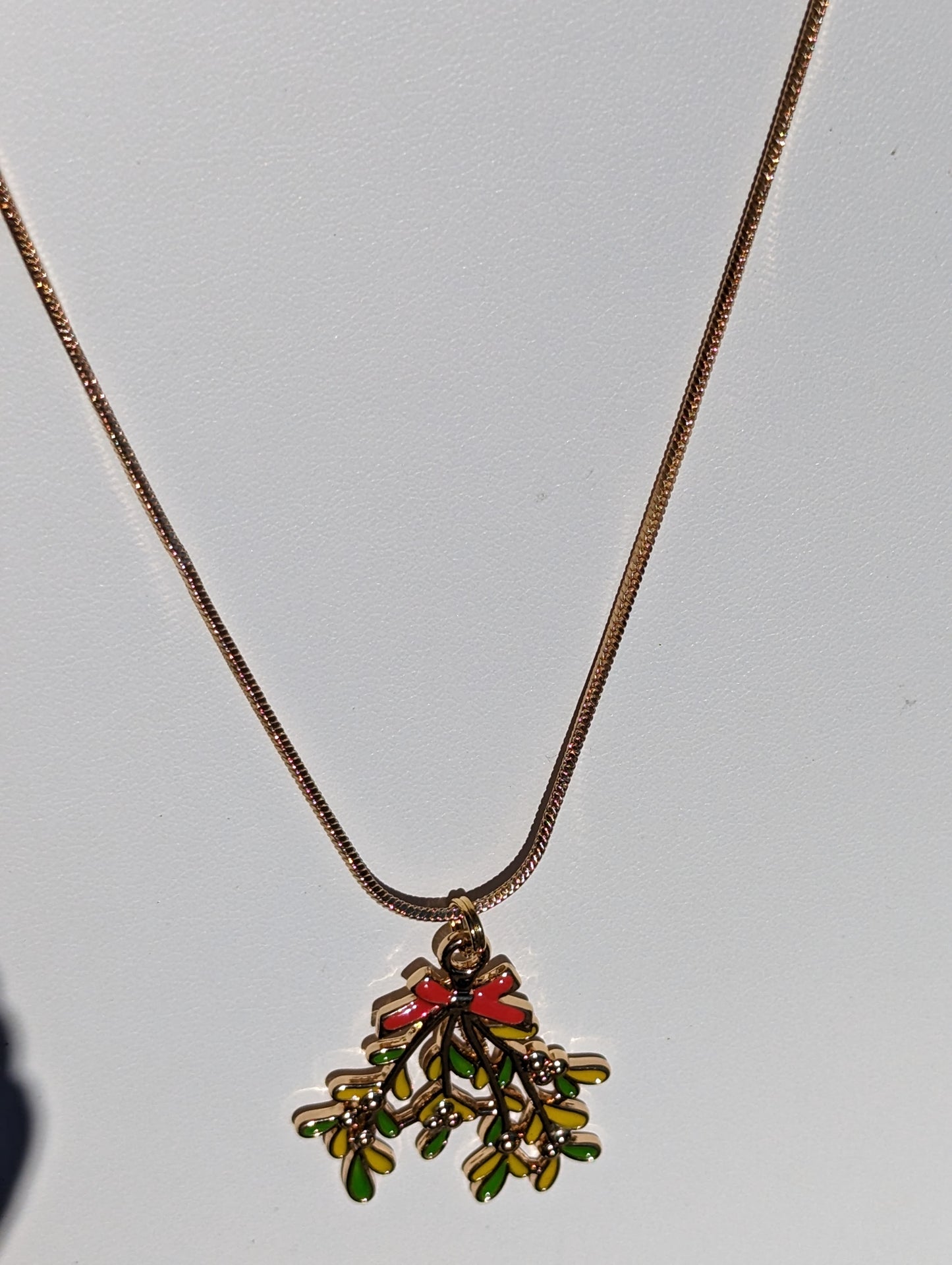 Golden Necklace with Mistletoe Pendant