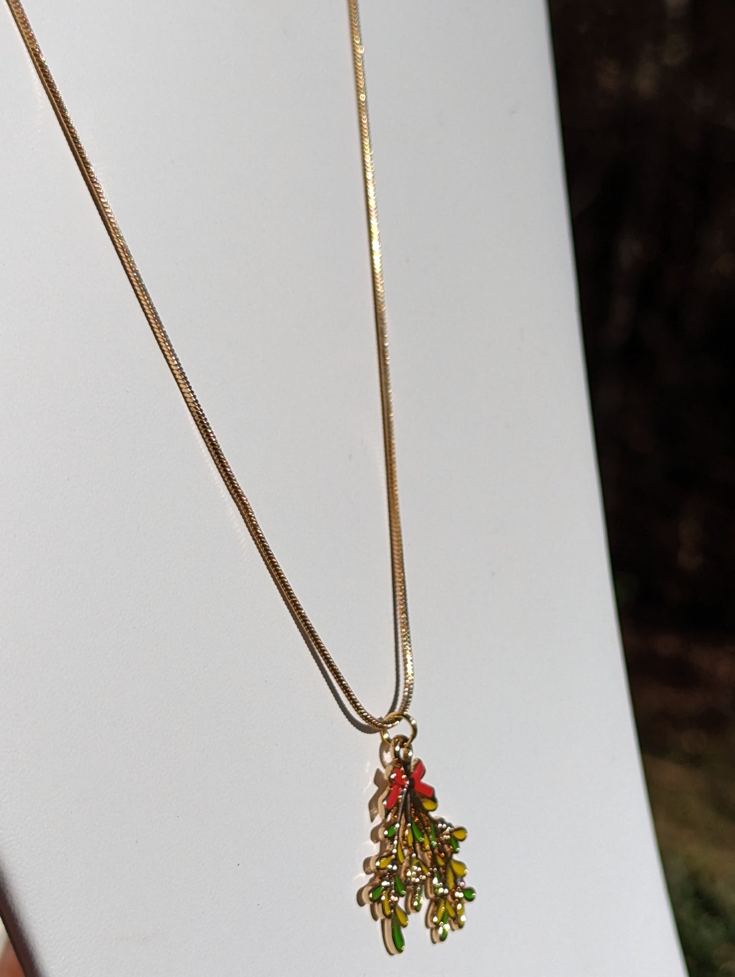 Golden Necklace with Mistletoe Pendant