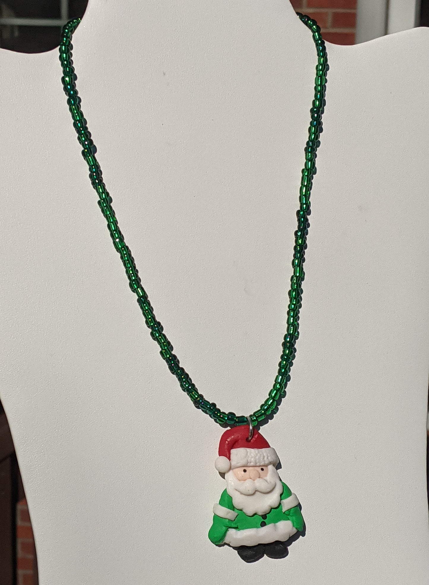 Clay Santa Pendant on Dark Green Beaded Necklace