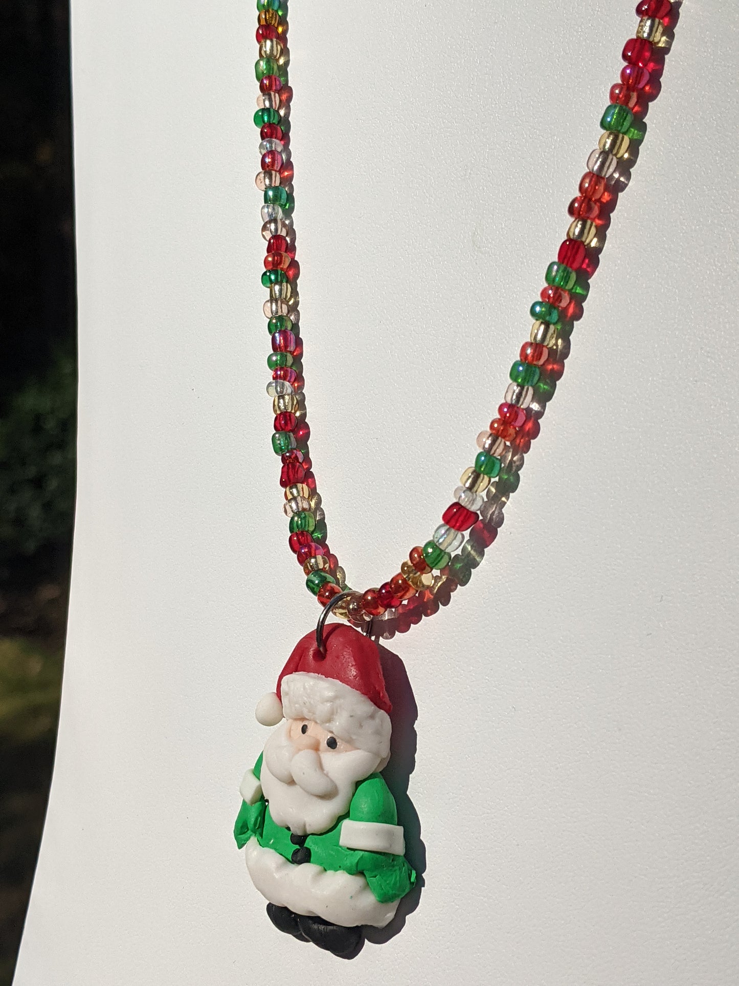 Dark Green Clay Santa on Multi-colored Beaded Necklace