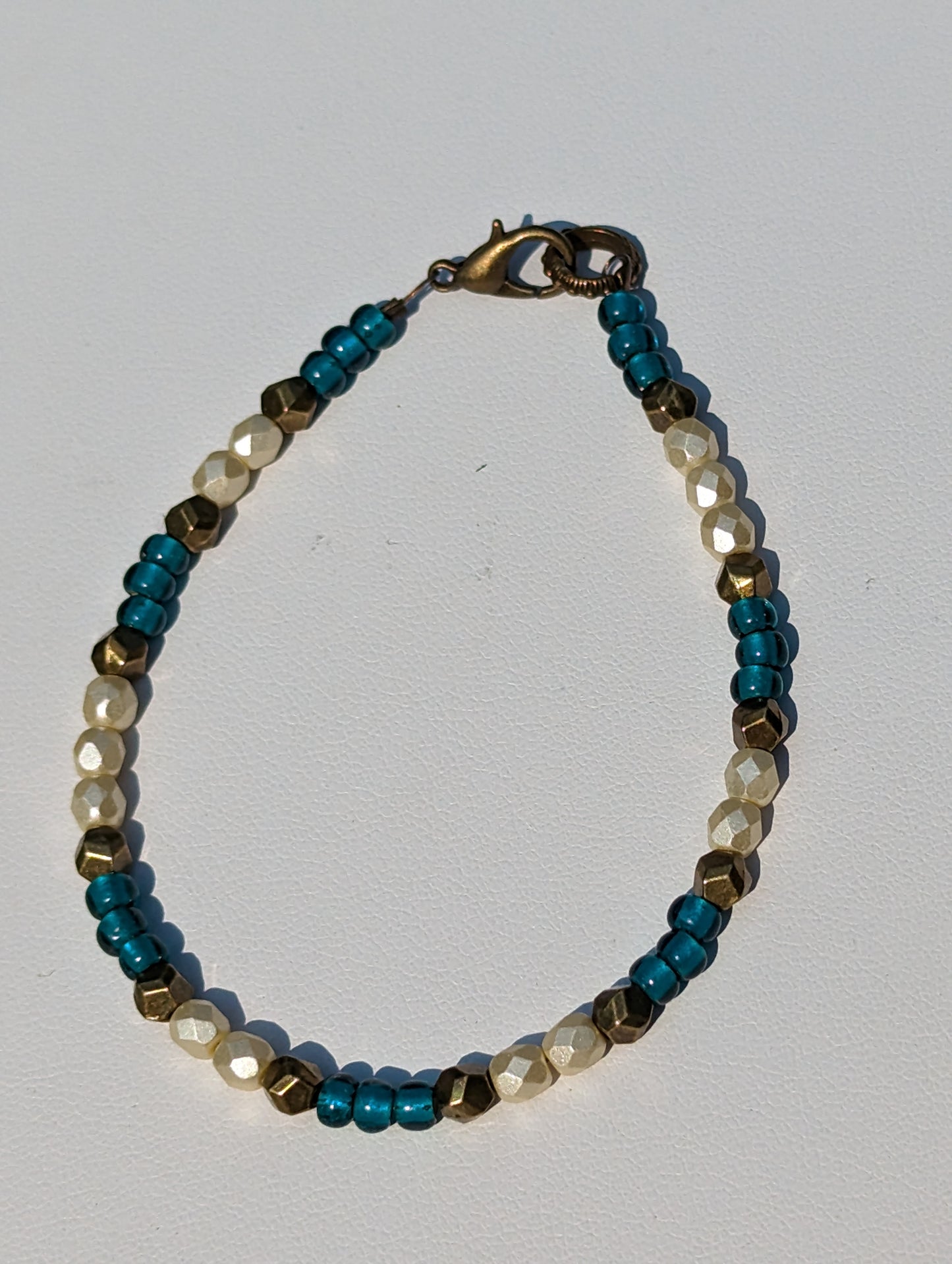 Bracelet with Teal, Pearlesque, and Brass Beads