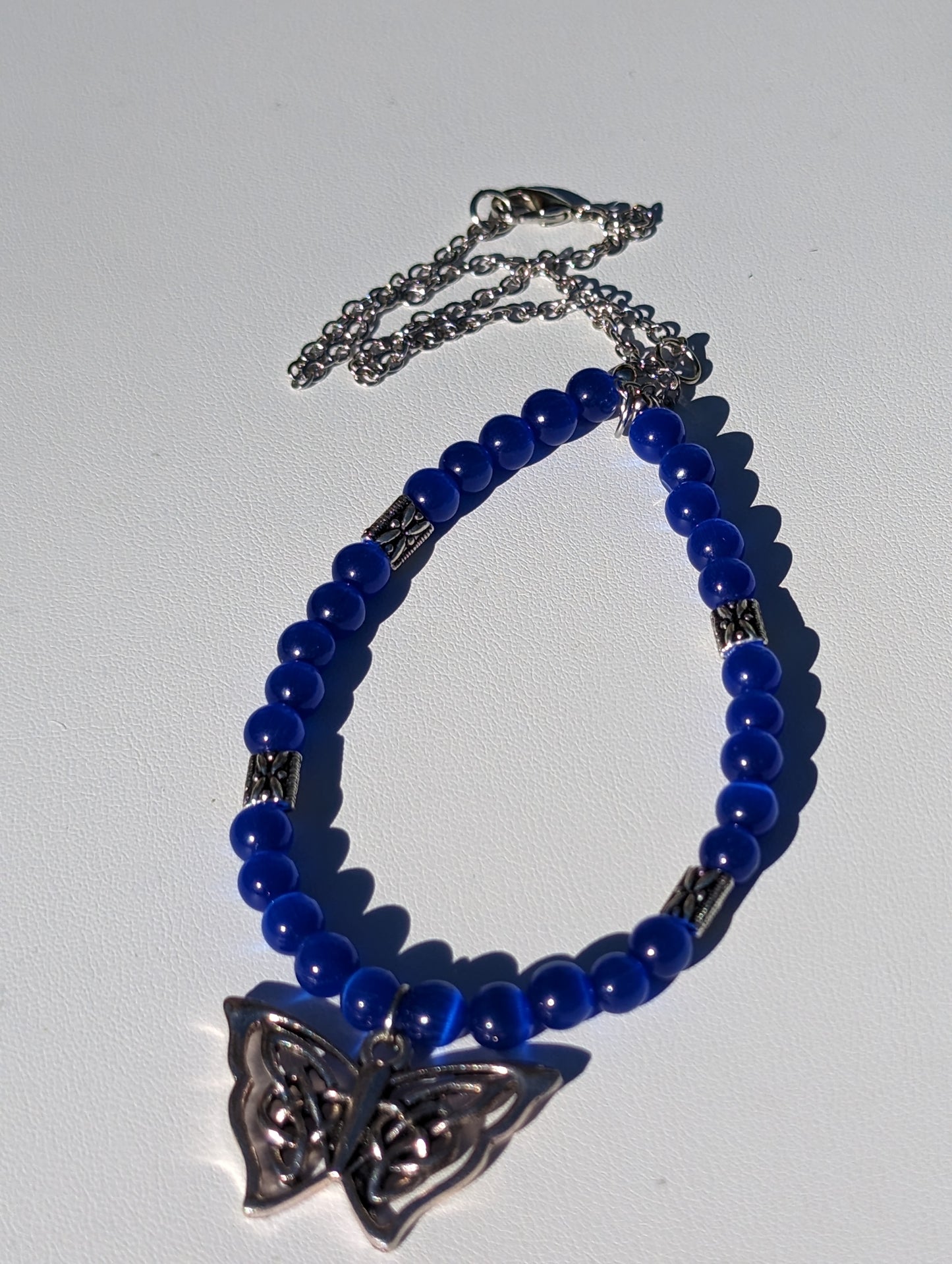 Royal Blue Cat's Eye Necklace with Celtic Butterfly Charm