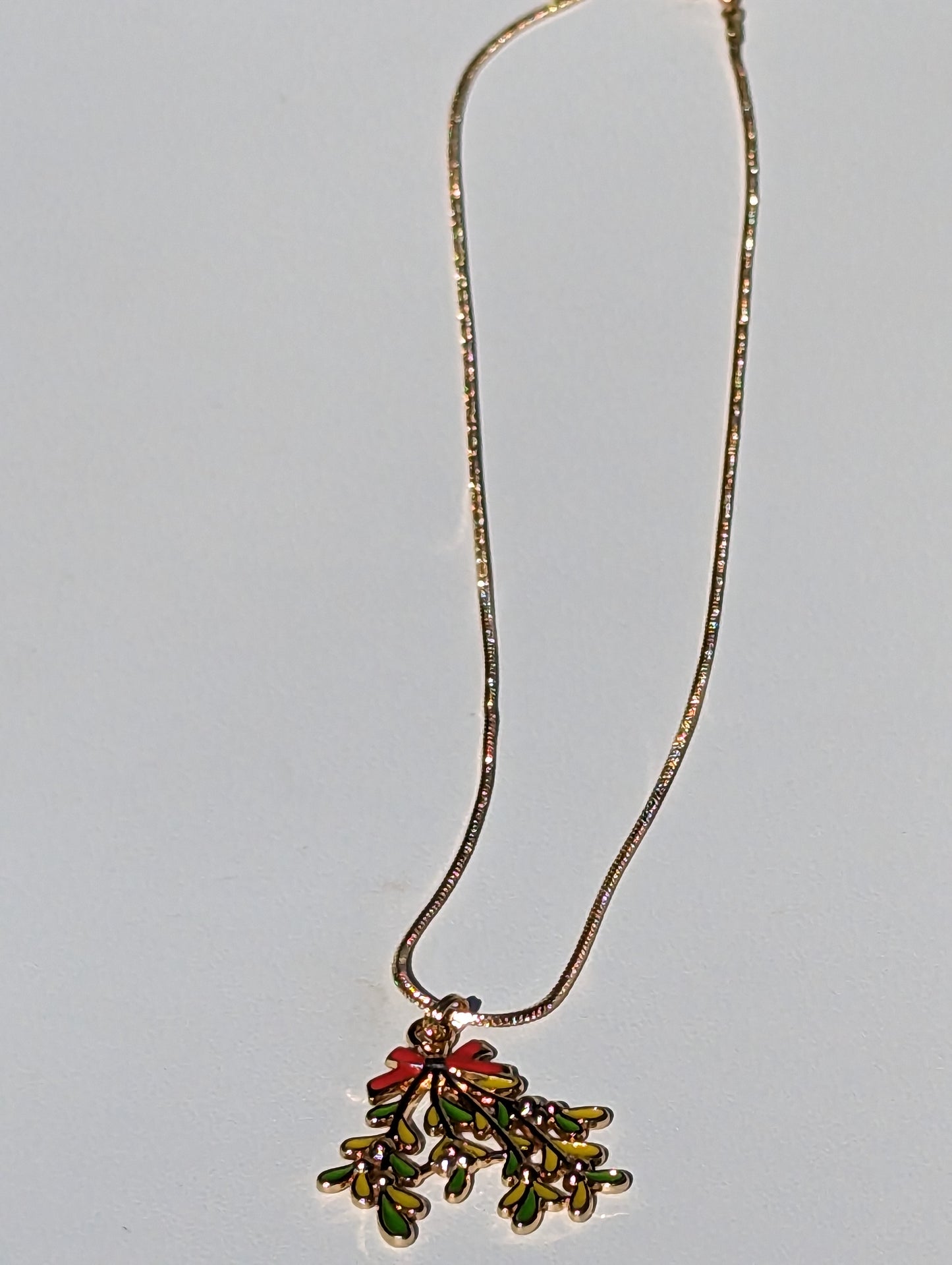 Golden Necklace with Mistletoe Pendant